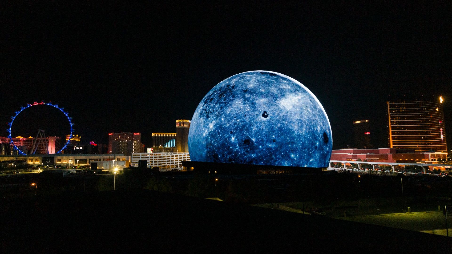 The Sphere — exterior view with LED panels illuminated at night, Las Vegas